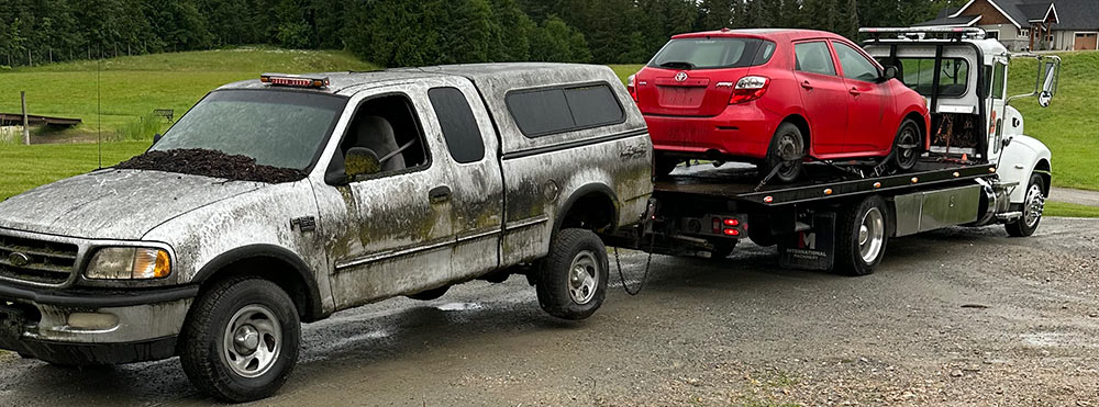 Scrap pickup truck and junk car being removed by Scrap Your Car